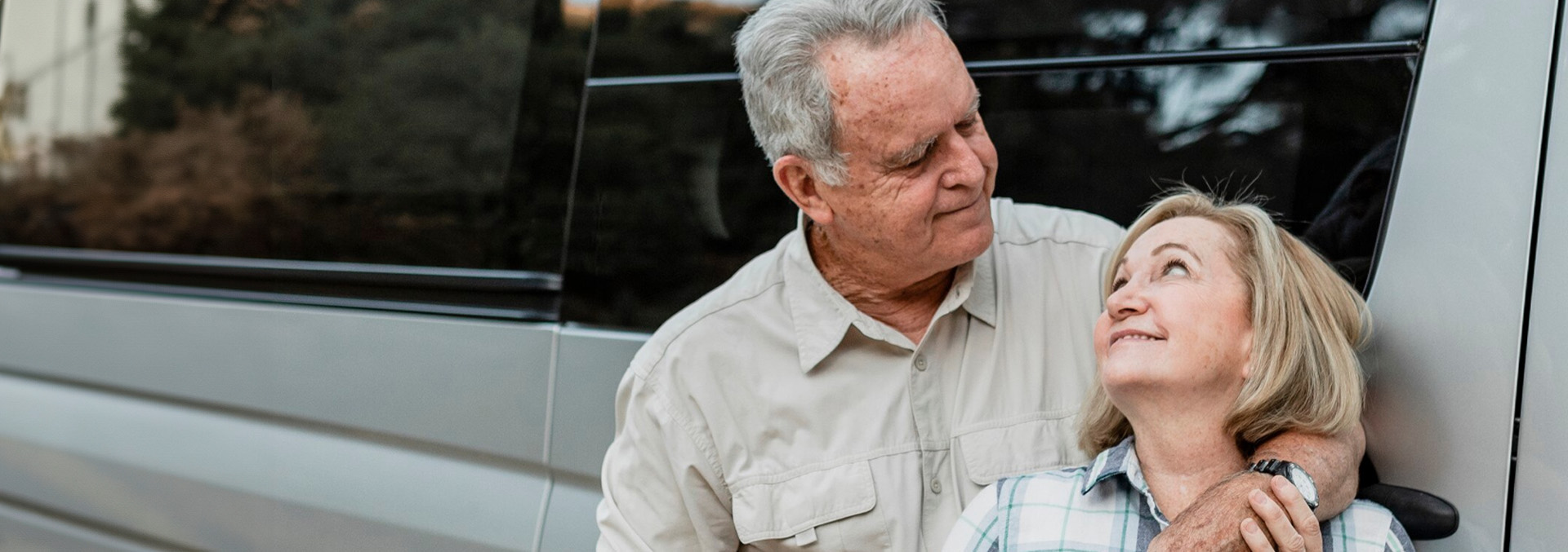 A retiree couple relaxing outside their RV, capturing the peaceful and leisurely lifestyle offered by long-term stays at Texas Lakes Ranch RV Park in Aubrey, TX.
