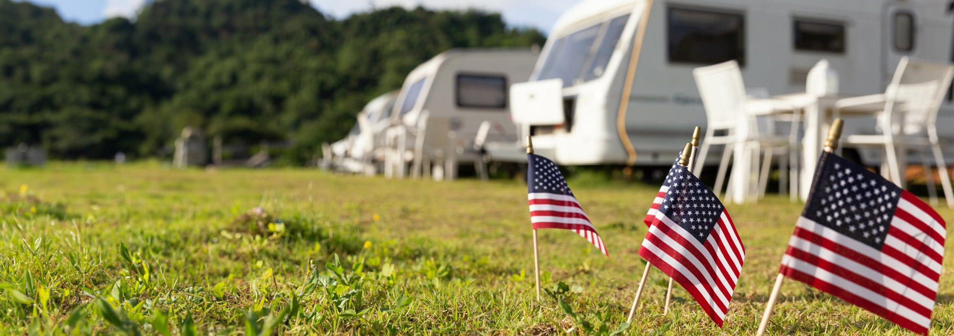  RVs parked under a vibrant Texas sunset, illustrating the peaceful and scenic setting of Texas Lakes Ranch RV Park in Aubrey, TX. 